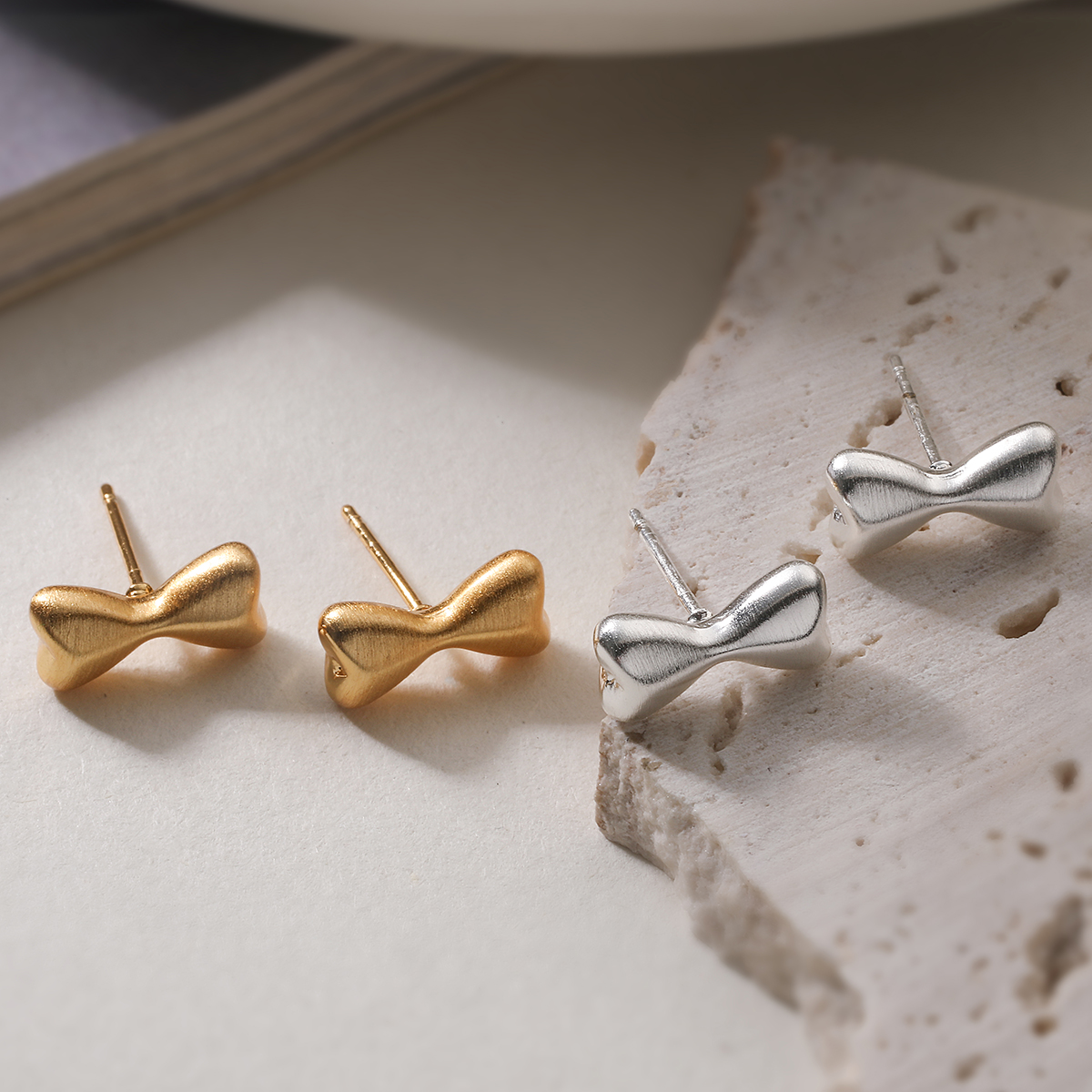 Brushed Bow Tie Stud Earrings For Women In Copper With 18K Real Gold Plated Water Plating And 0.03µm Thickness