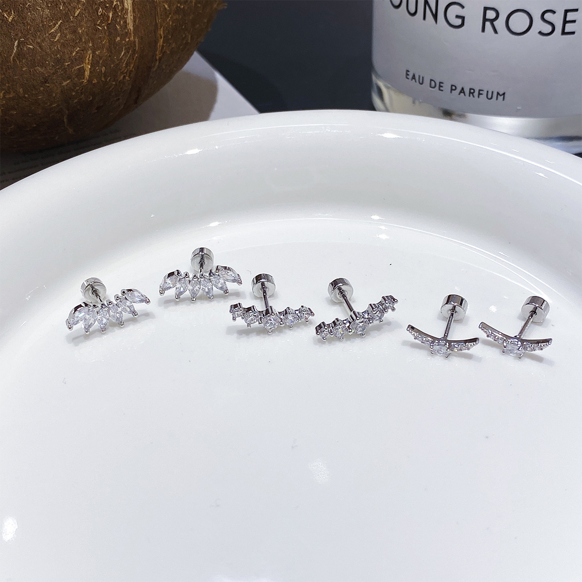 Crown Stud Earrings In Copper With Platinum Electroplated Finish Featuring Zircon Inlay And Flat Back Studs