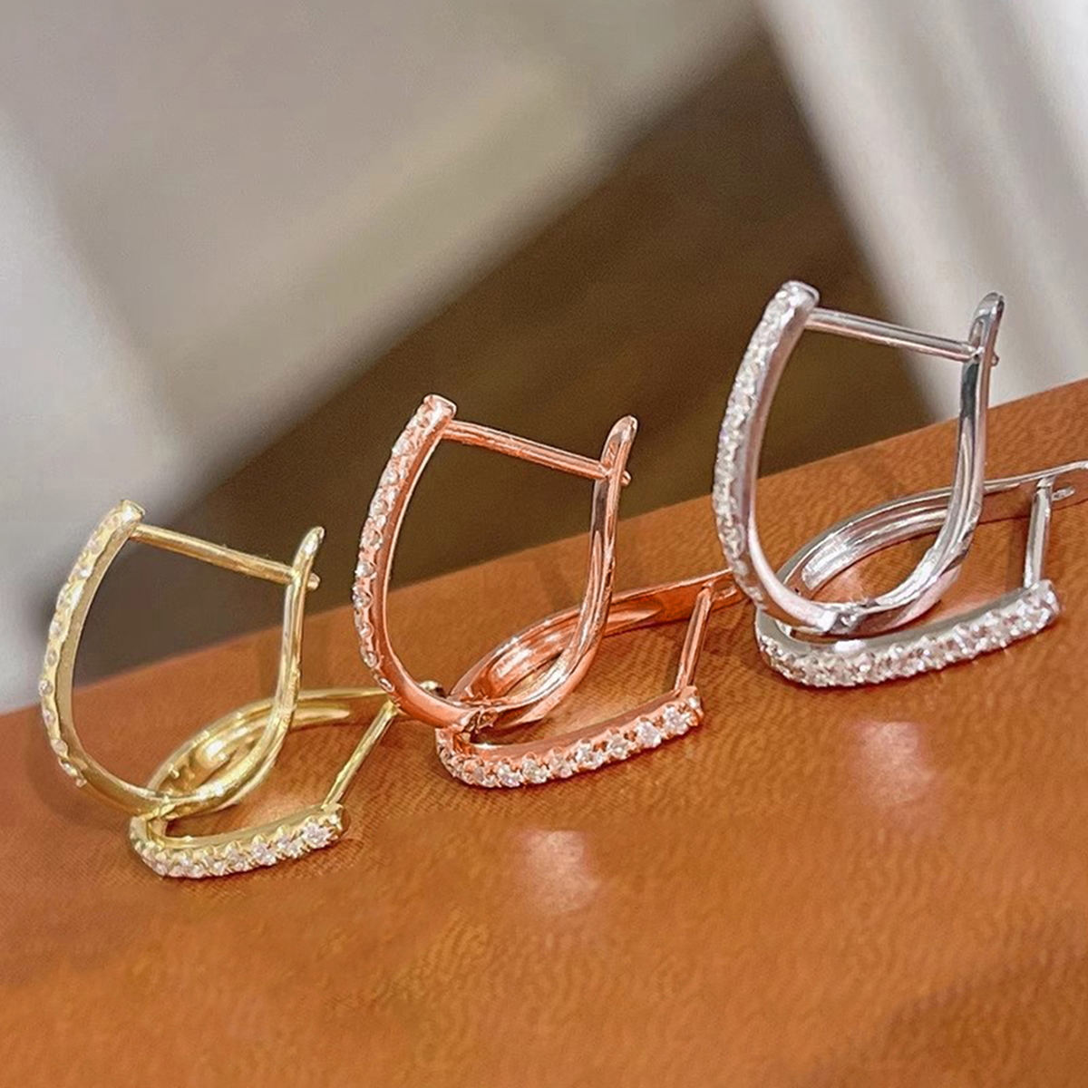 Geometric Claw Setting Earrings In Copper With KC Golden Water Plating And 0.03µm Thickness Featuring Zircon Inlay