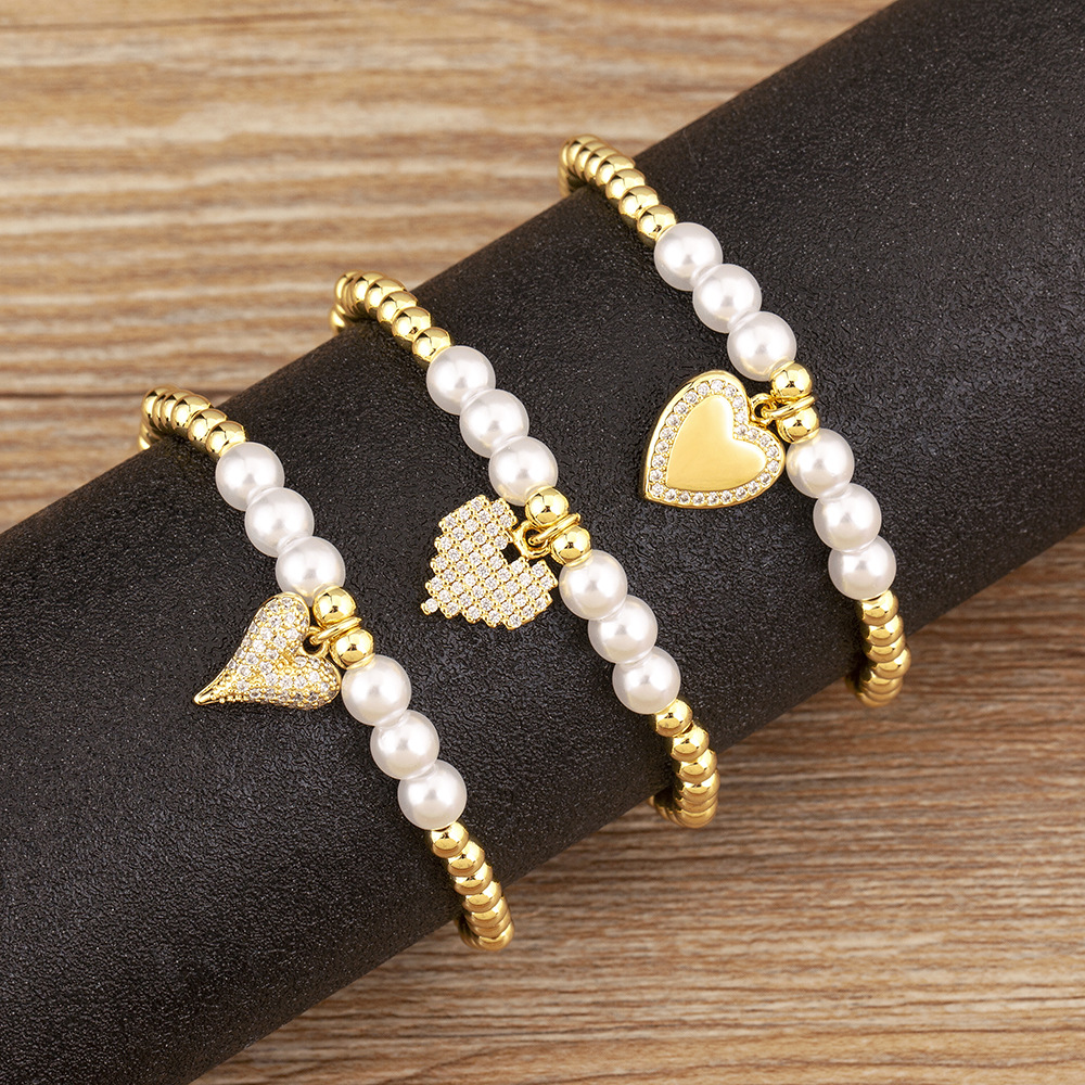Heart Shape Beaded Bracelet For Women In Copper With Golden Electroplated Finish And Imitation Pearl Inlay