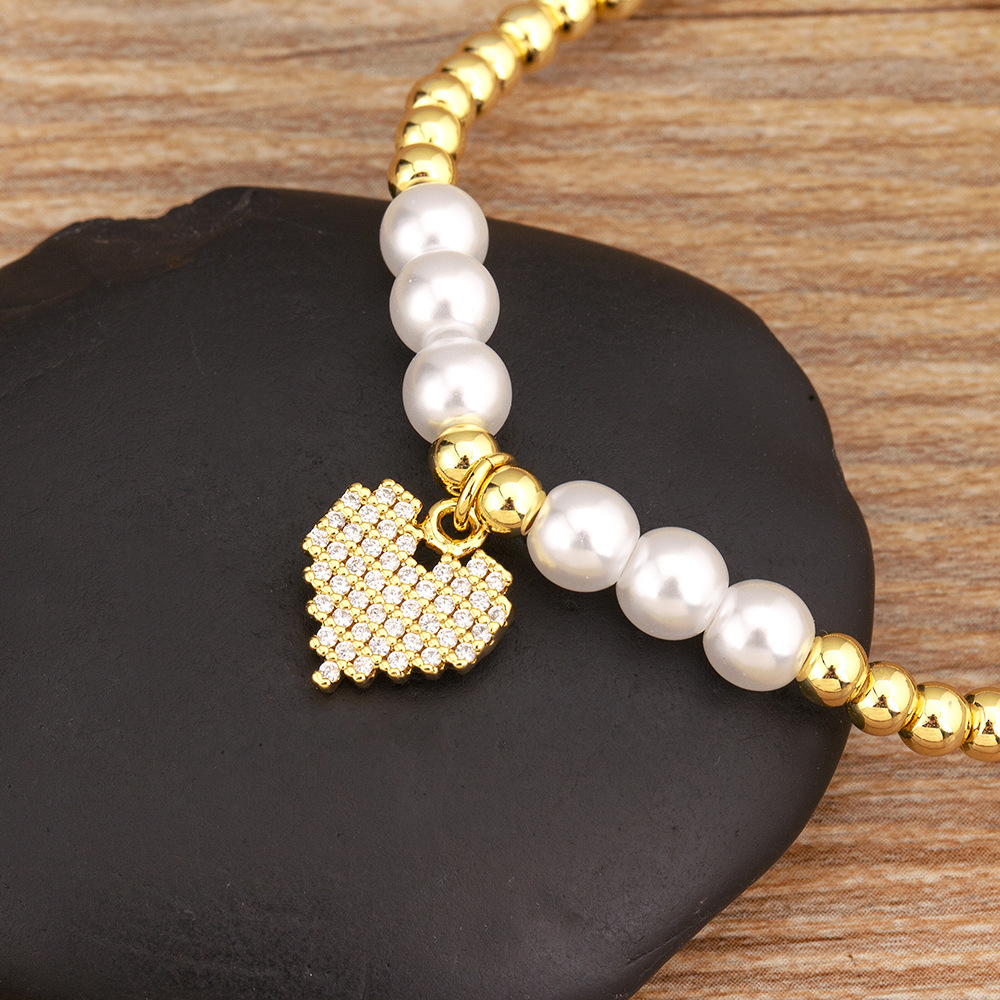 Heart Shape Beaded Bracelet For Women In Copper With Golden Electroplated Finish And Imitation Pearl Inlay 4