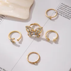 Set Of 5 Gold Alloy Star Rings For Women With Rhinestones, Featuring 0.01µm Coating Thickness 4