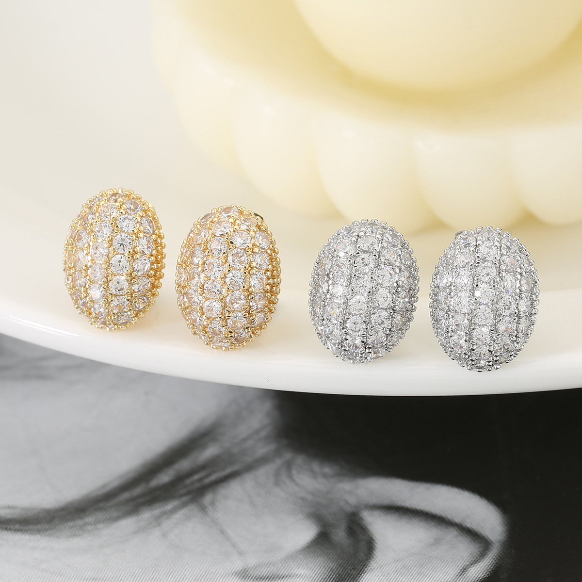 Unisex Oval Clip Earrings In Golden Copper With Electroplated Gold Plating And Rhinestone Inlay